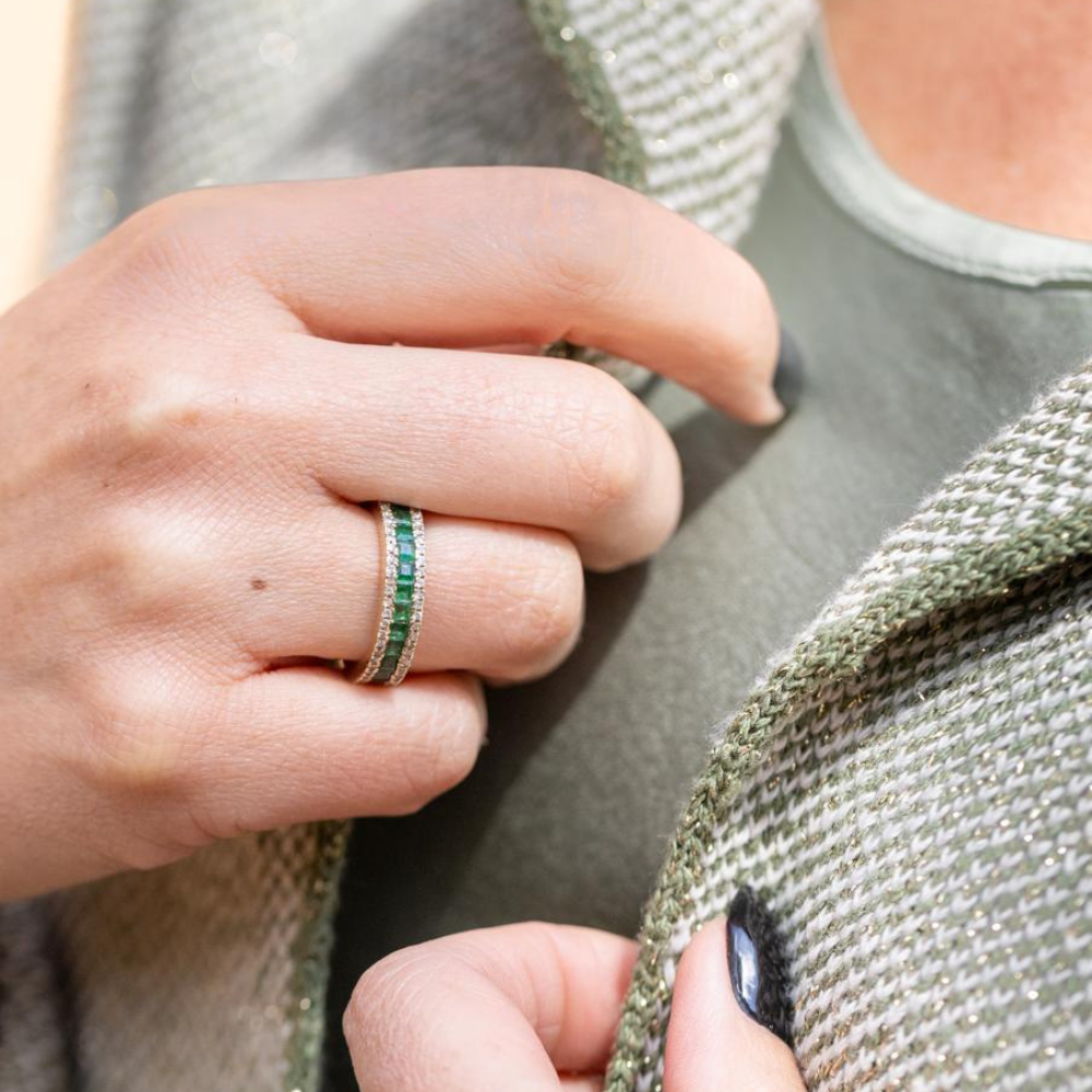 Square emeralds set with diamonds on either side, all in 9ct yellow gold.